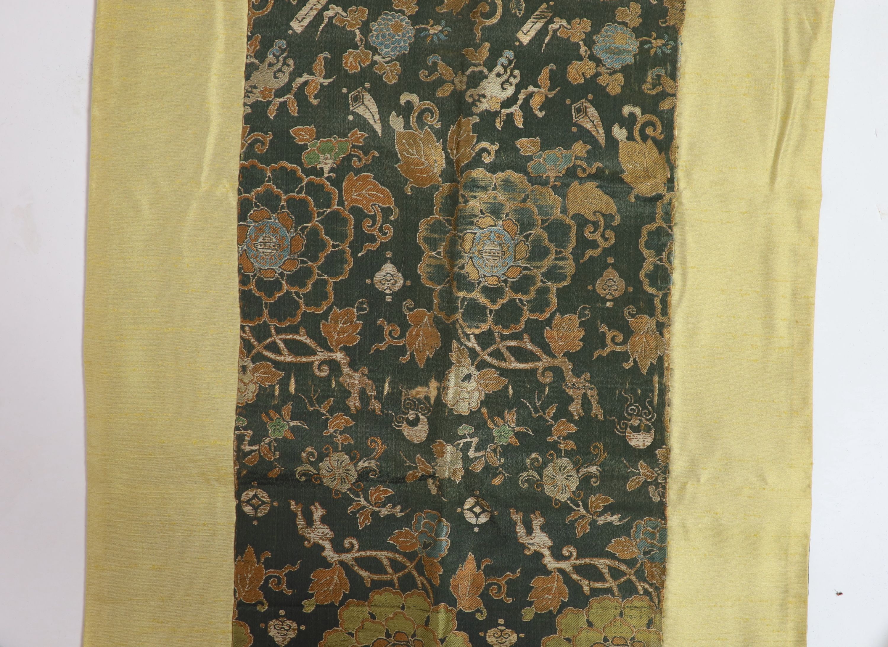 A Chinese brocade panel, 17th/18th century, Total size 169cm x 54cm